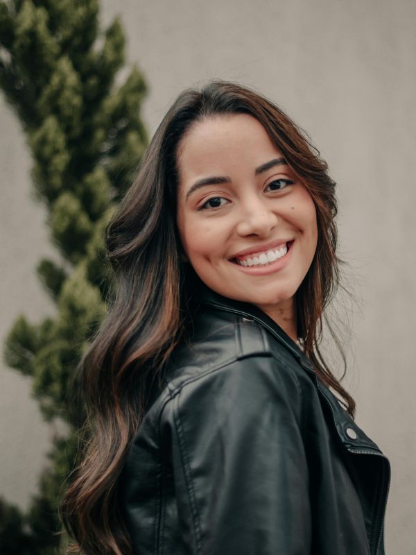 Smiling woman after emergency dental care at Wash Park Family Dental in Denver