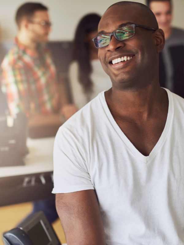 Man smiling after cosmetic dentistry at Wash Park Family Dental in Denver