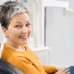 Smiling patient in the dental chair at a family dentist in Denver