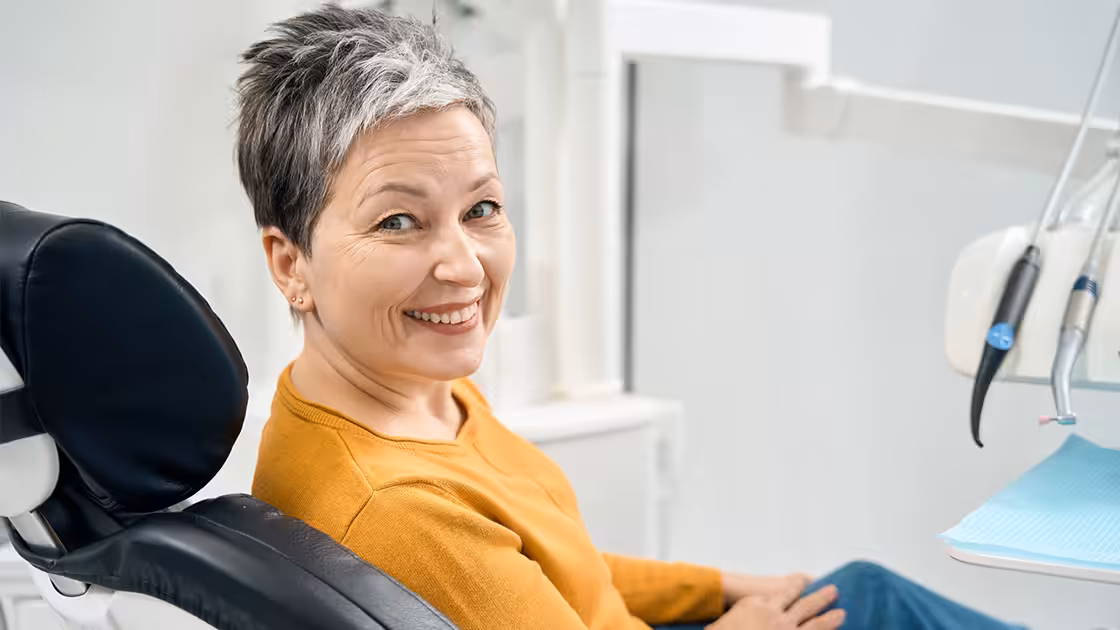 Smiling patient in the dental chair at a family dentist in Denver